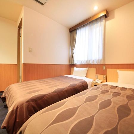 Sendai Business Hotel Bagian luar foto