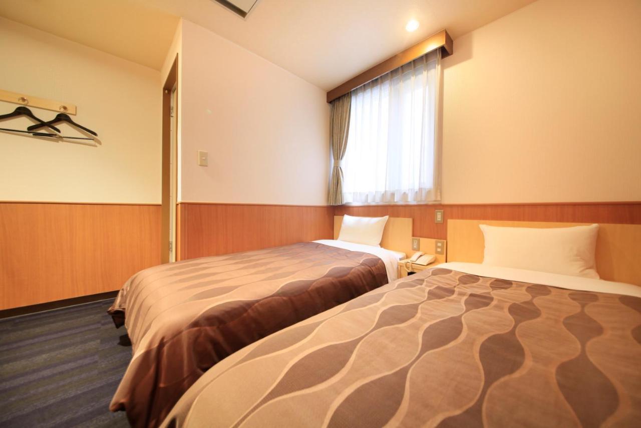 Sendai Business Hotel Bagian luar foto