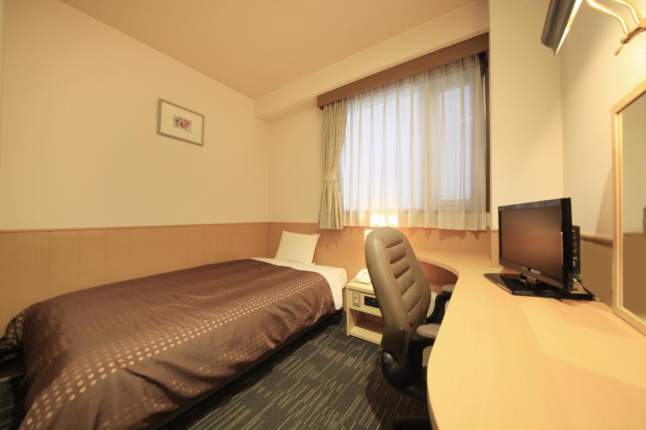 Sendai Business Hotel Bagian luar foto