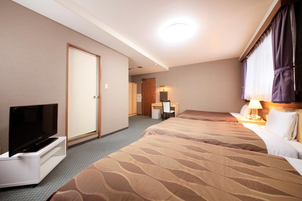 Sendai Business Hotel Bagian luar foto