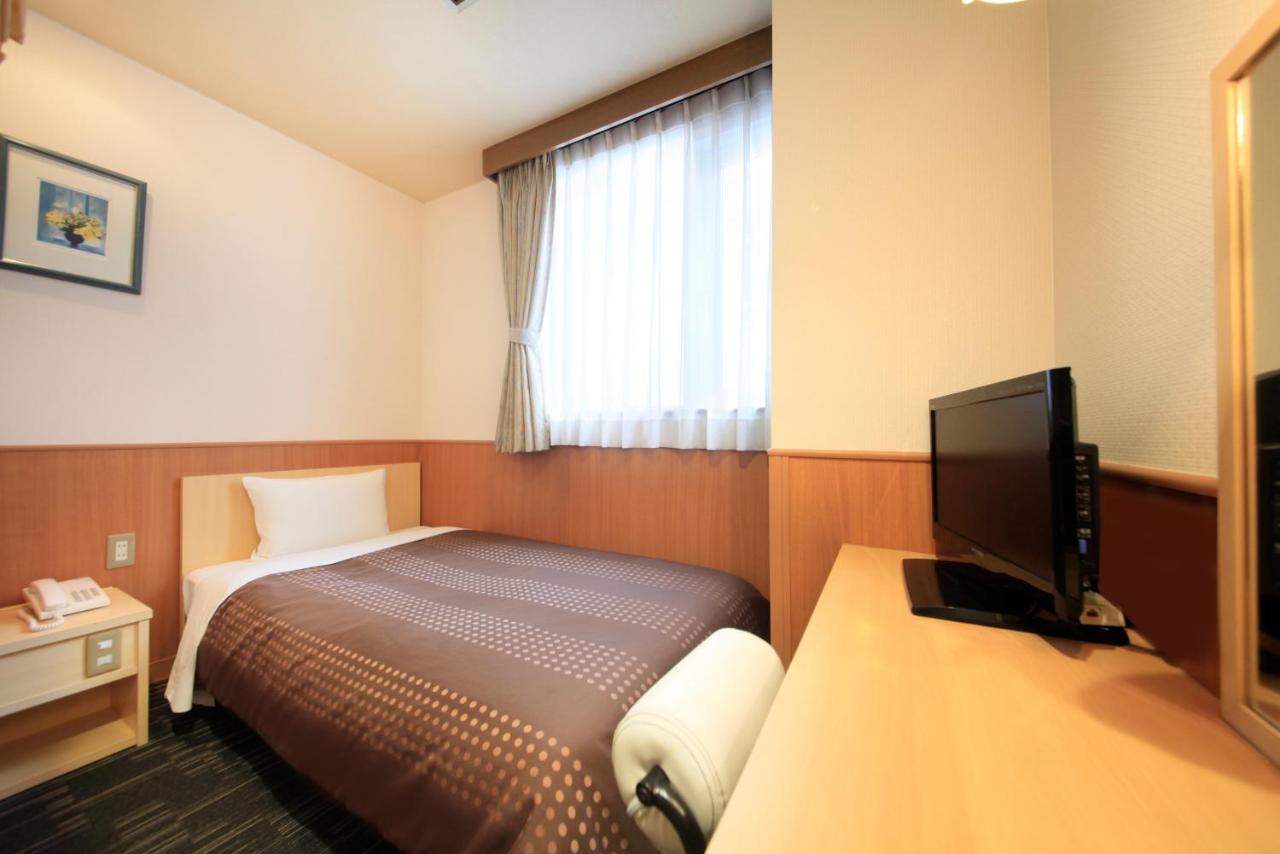 Sendai Business Hotel Bagian luar foto