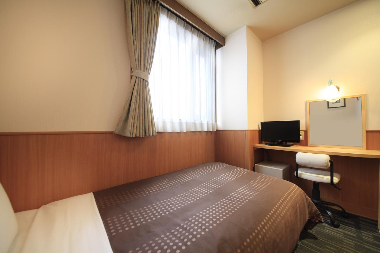 Sendai Business Hotel Bagian luar foto