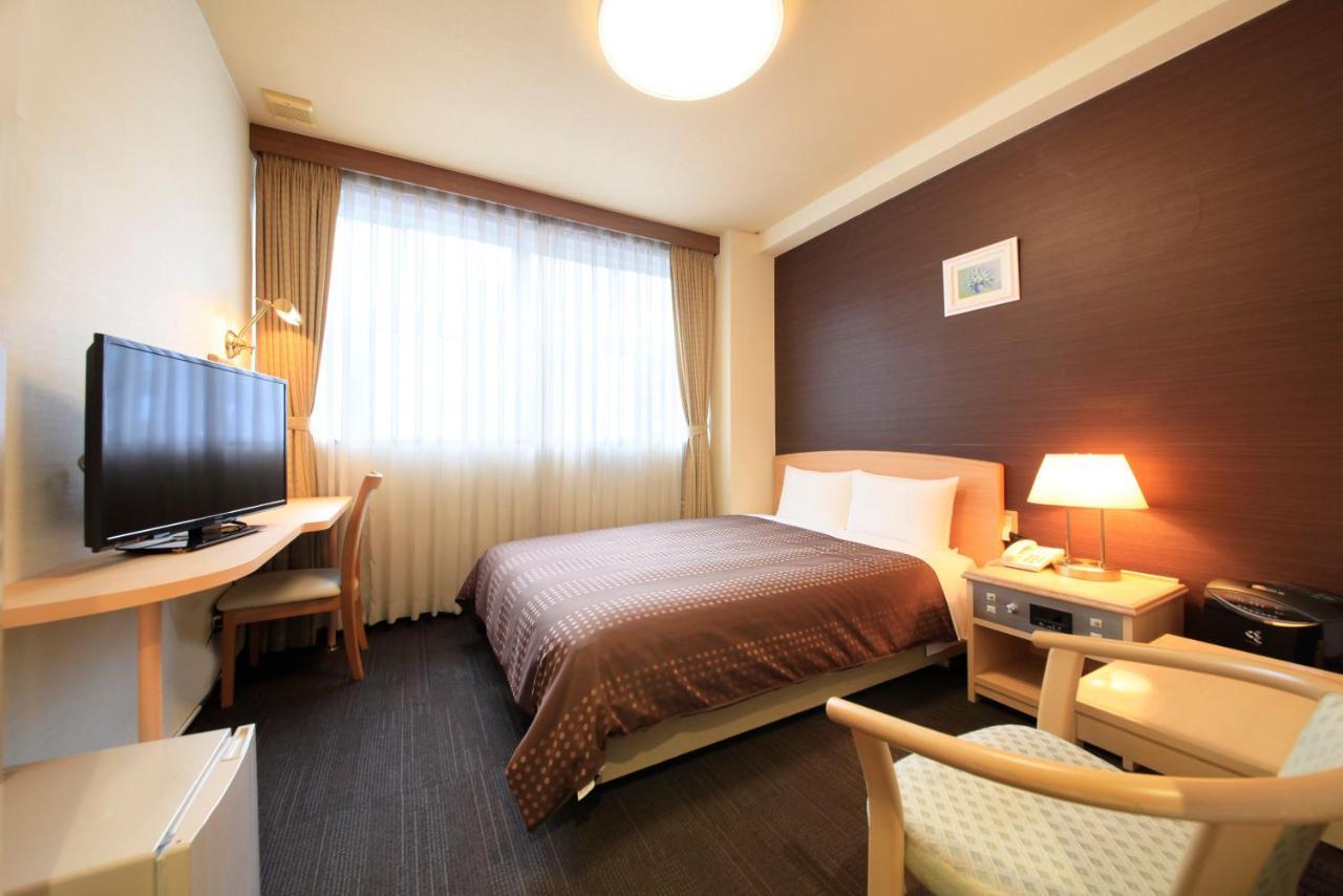 Sendai Business Hotel Bagian luar foto