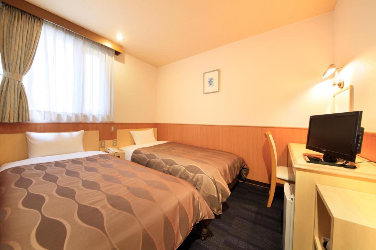 Sendai Business Hotel Bagian luar foto