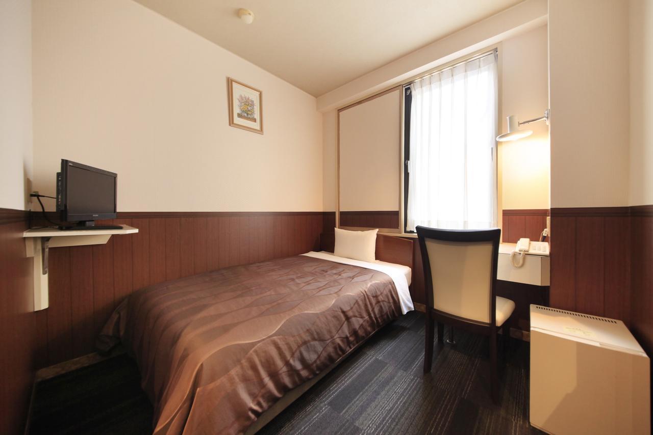 Sendai Business Hotel Bagian luar foto